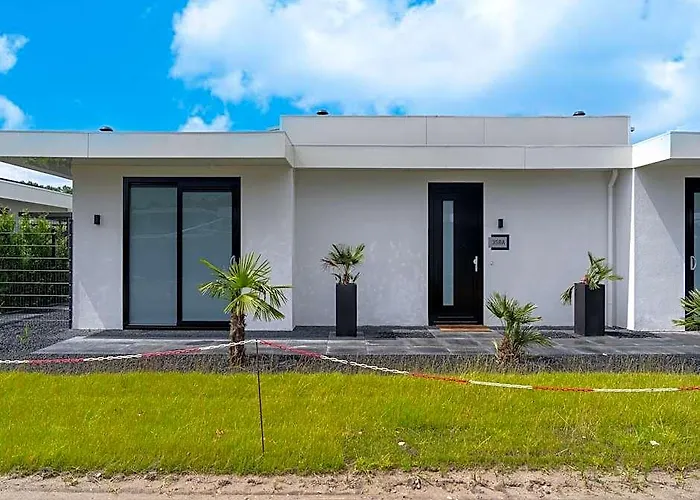 Villa With Covered Terrace And Jetty On The Water